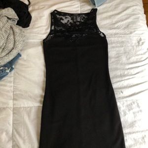 tight black sleeveless dress